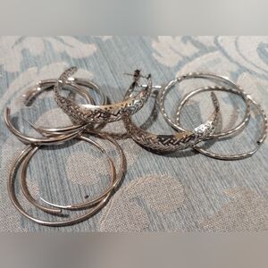 Silver tone hoop earrings (4) sets included